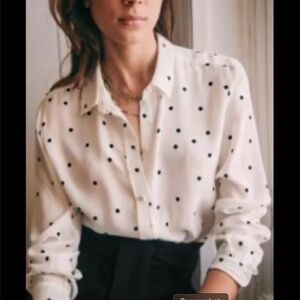 Silk button up shirt with fun polka dot details. A great staple with a twist!
